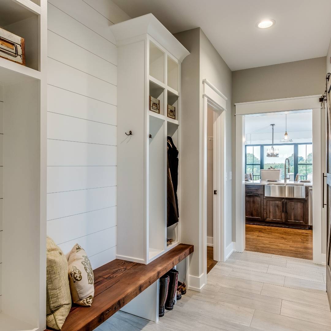 Mudroom with custom shelves and a bench